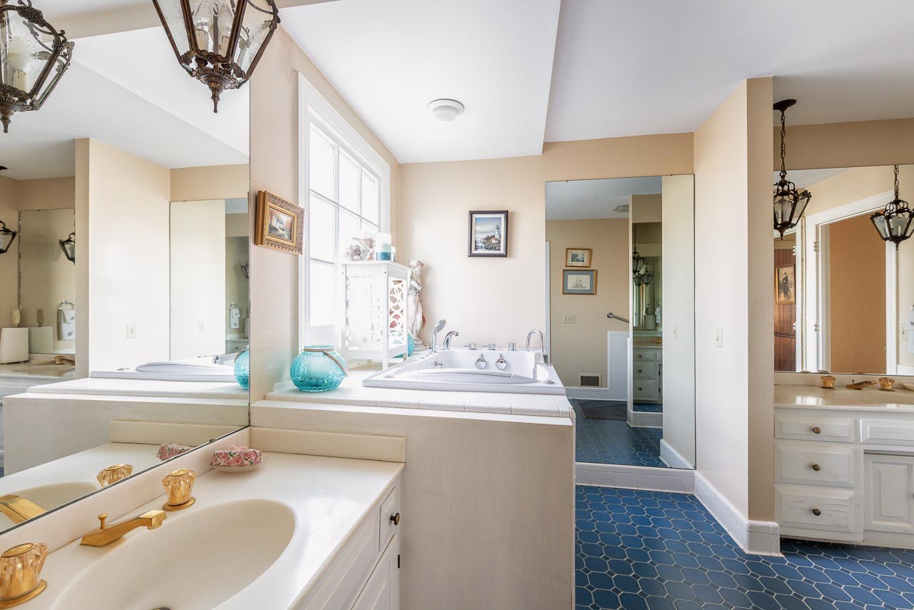 4832 Murfreesboro Road Arrington, TN 37014 - Photo 17 of 70 a bathroom with a sink double vanity and a mirror