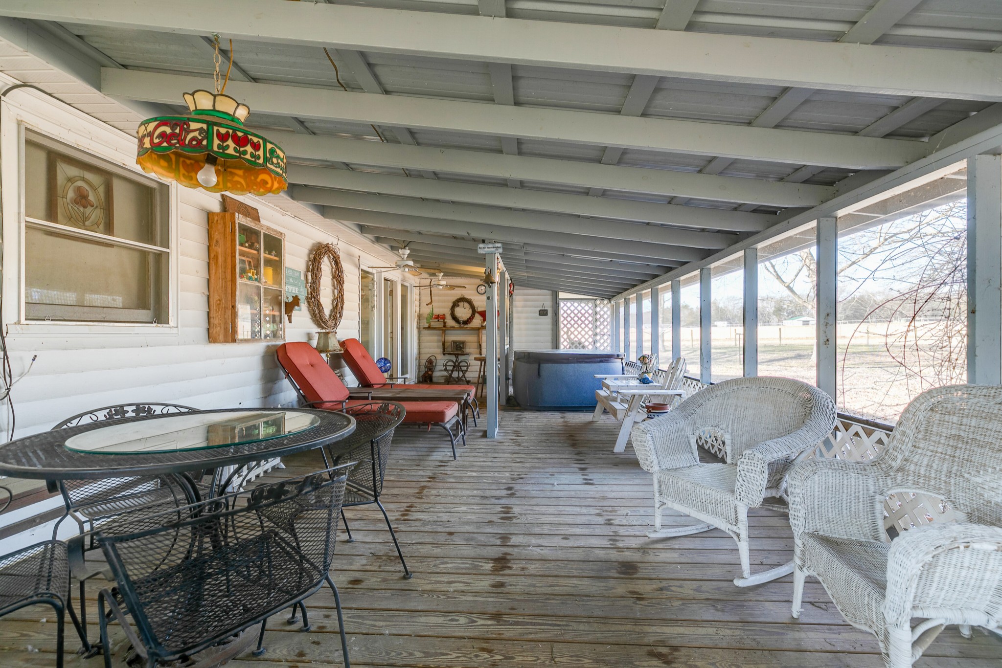 4832 Murfreesboro Road Arrington, TN 37014 - Photo 64 of 70 a living room with furniture a chandelier and a dining table