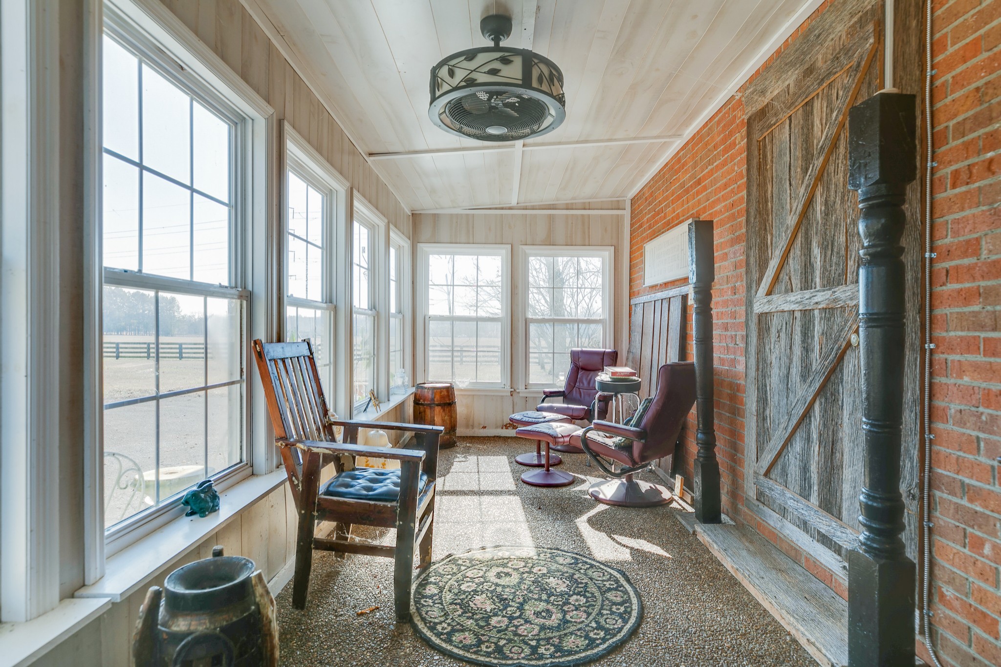 4832 Murfreesboro Road Arrington, TN 37014 - Photo 66 of 70 a living room with furniture and floor to ceiling windows