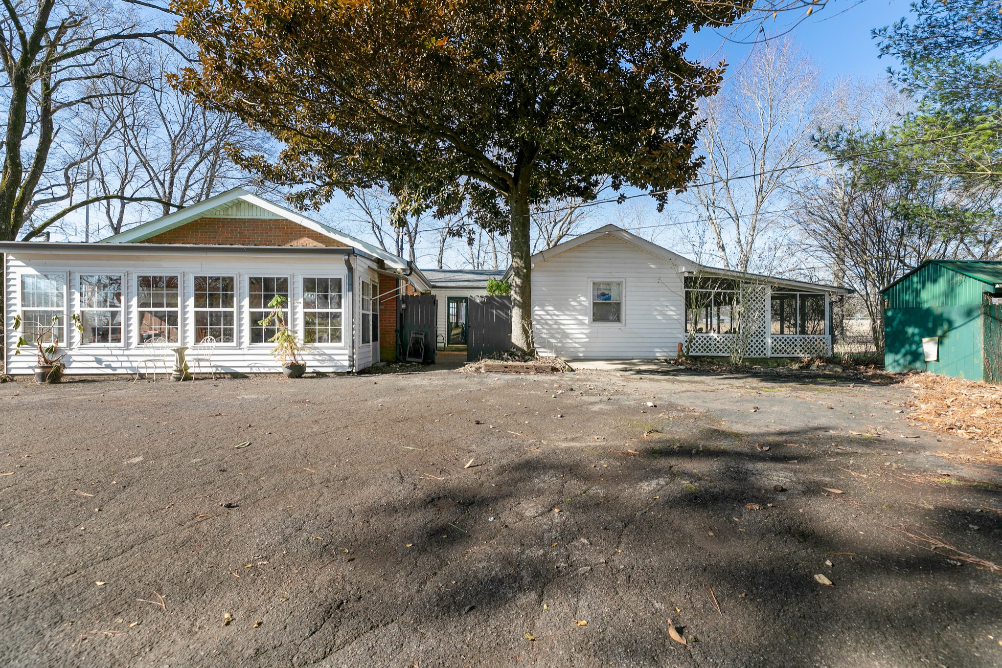 4832 Murfreesboro Road Arrington, TN 37014 - Photo 68 of 70 a view of a white house with a large tree and large trees
