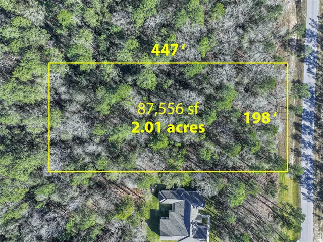 an aerial view of a houses and roads