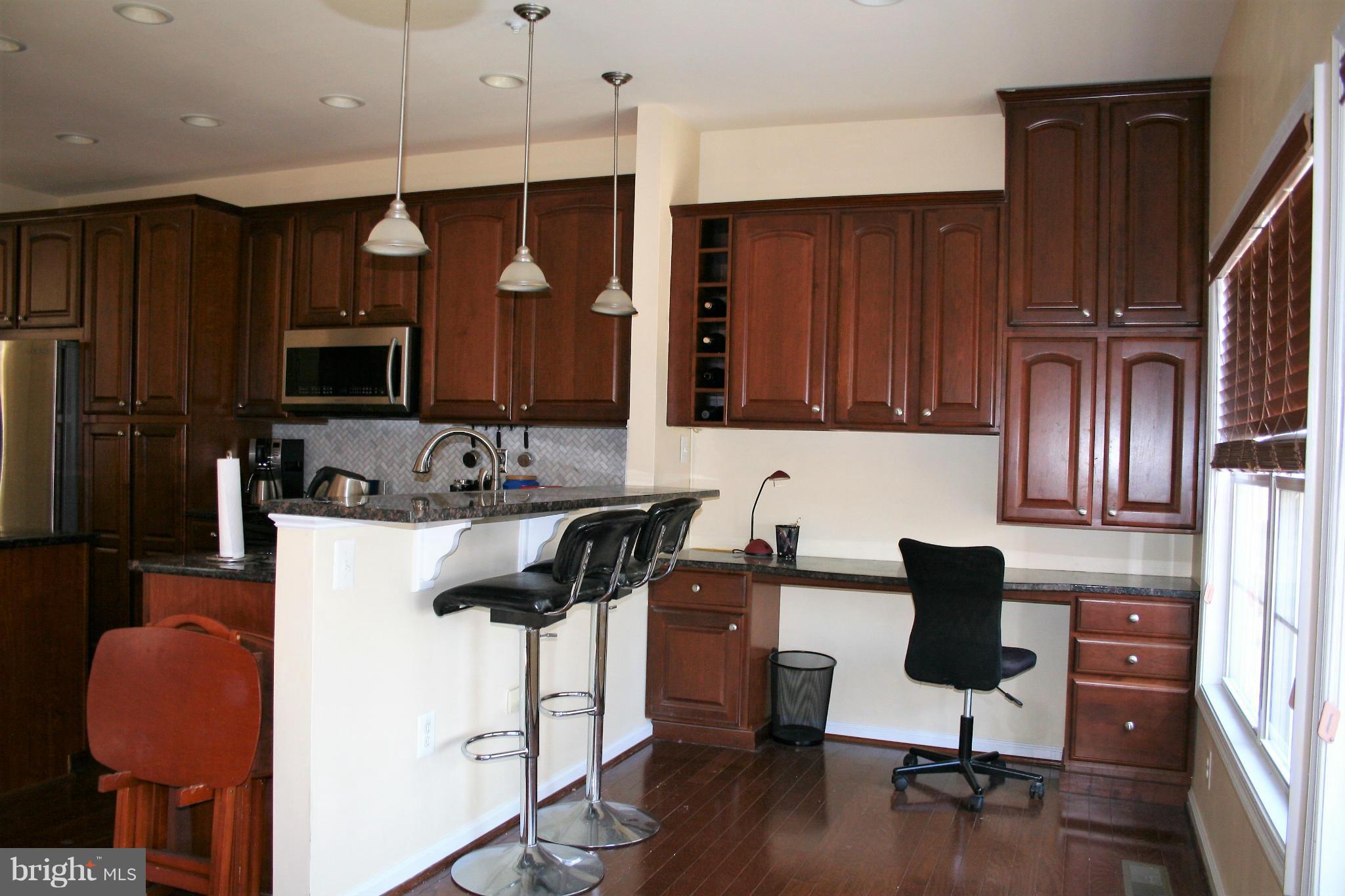 10238 Brighton Ridge Way, Unit 107 Columbia, MD 21044 - Photo 9 of 28 Desk Area Plus Cabinets