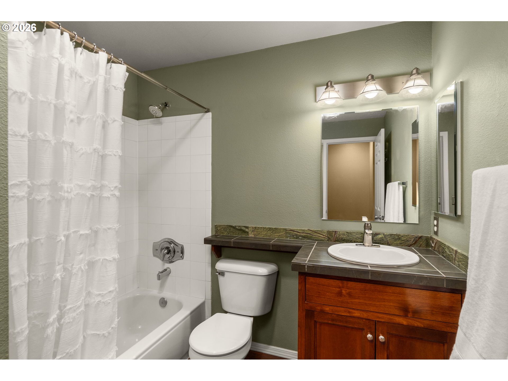 1814 Southeast Cutter Lane Vancouver, WA 98661 - Photo 19 of 40 a bathroom with a sink and a mirror