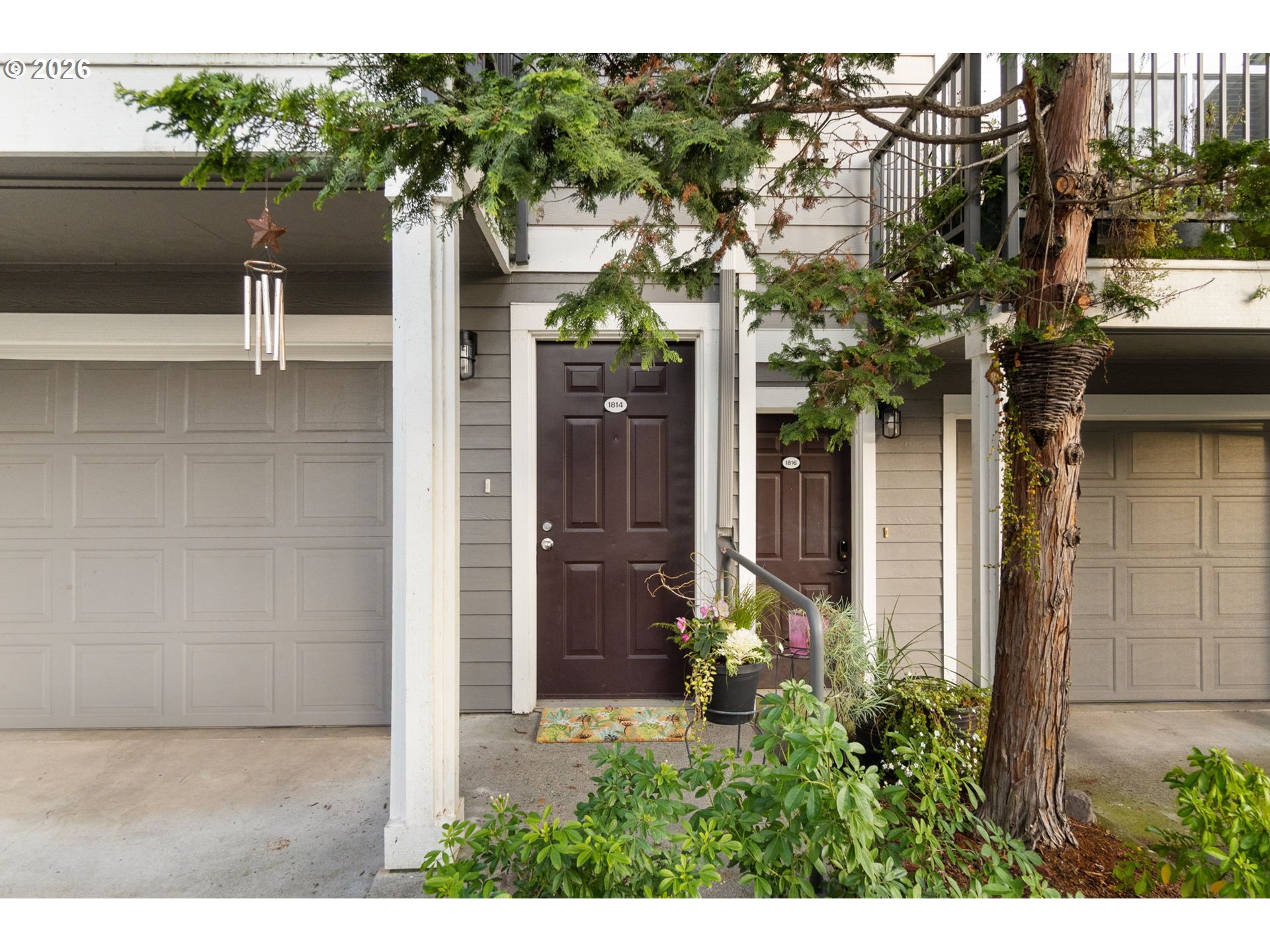 1814 Southeast Cutter Lane Vancouver, WA 98661 - Photo 3 of 40 a front view of a house with a tree