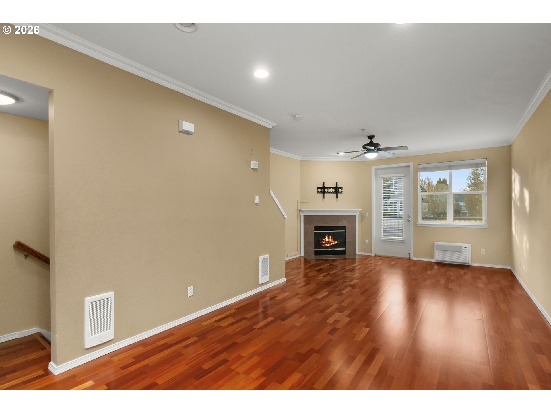1814 Southeast Cutter Lane Vancouver, WA 98661 - Photo 7 of 40 a view of an empty room with a fireplace and a window