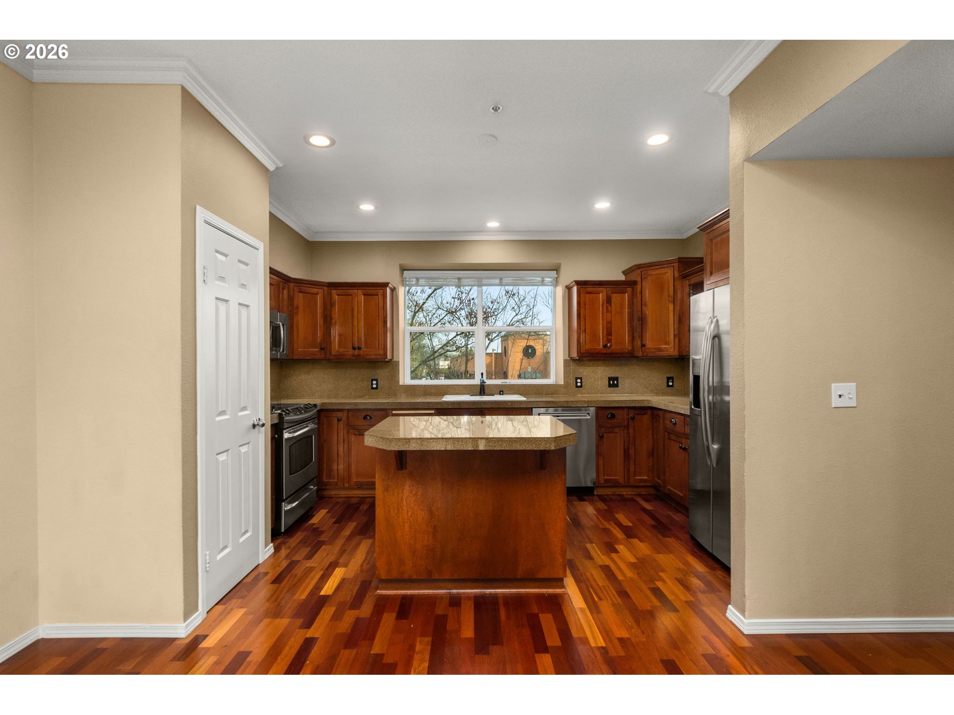 1814 Southeast Cutter Lane Vancouver, WA 98661 - Photo 9 of 40 a kitchen with kitchen island a counter top space a sink stainless steel appliances and cabinets