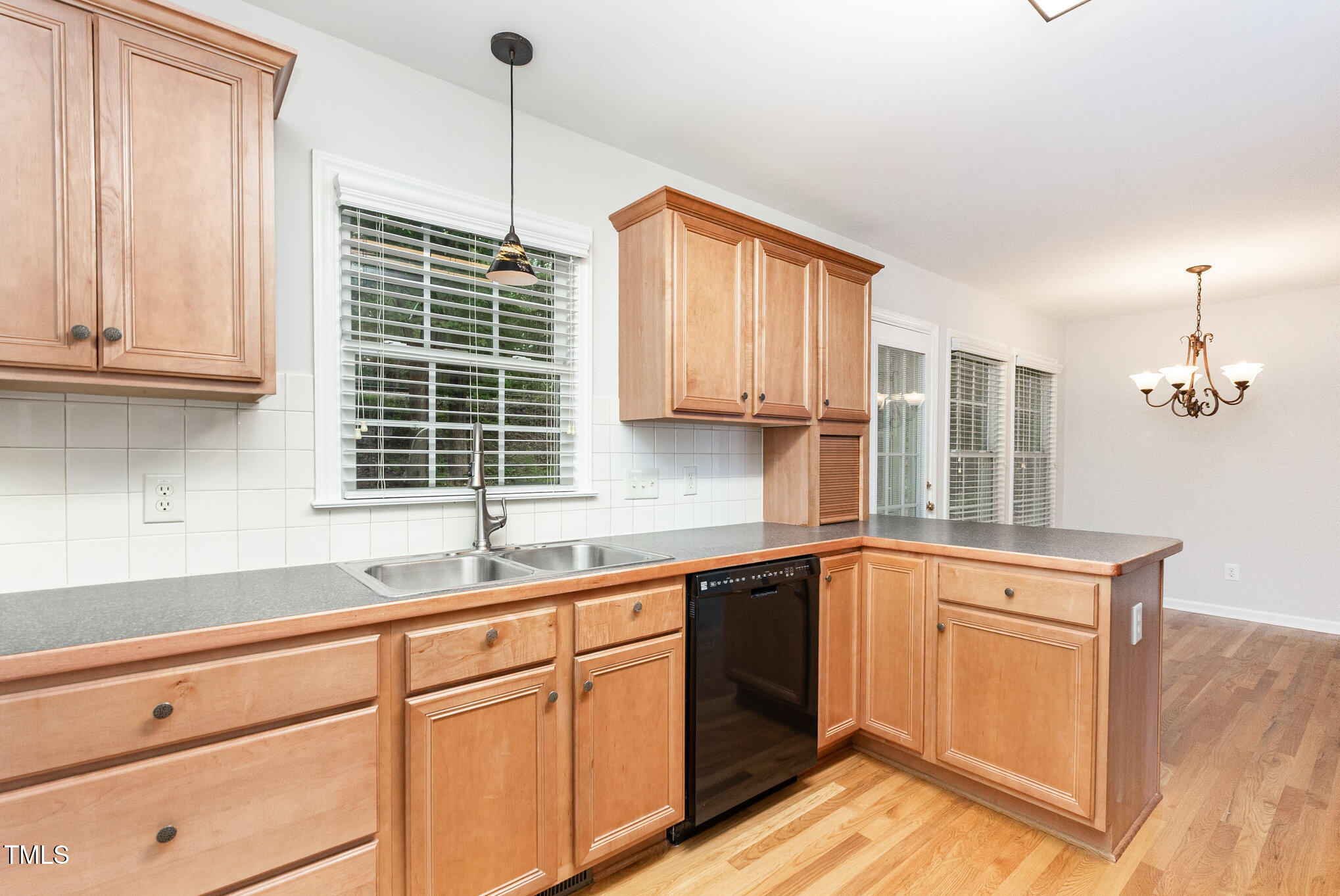 8401 Hobhouse Circle Raleigh, NC 27615 - Photo 11 of 27 a kitchen with a sink cabinets and window