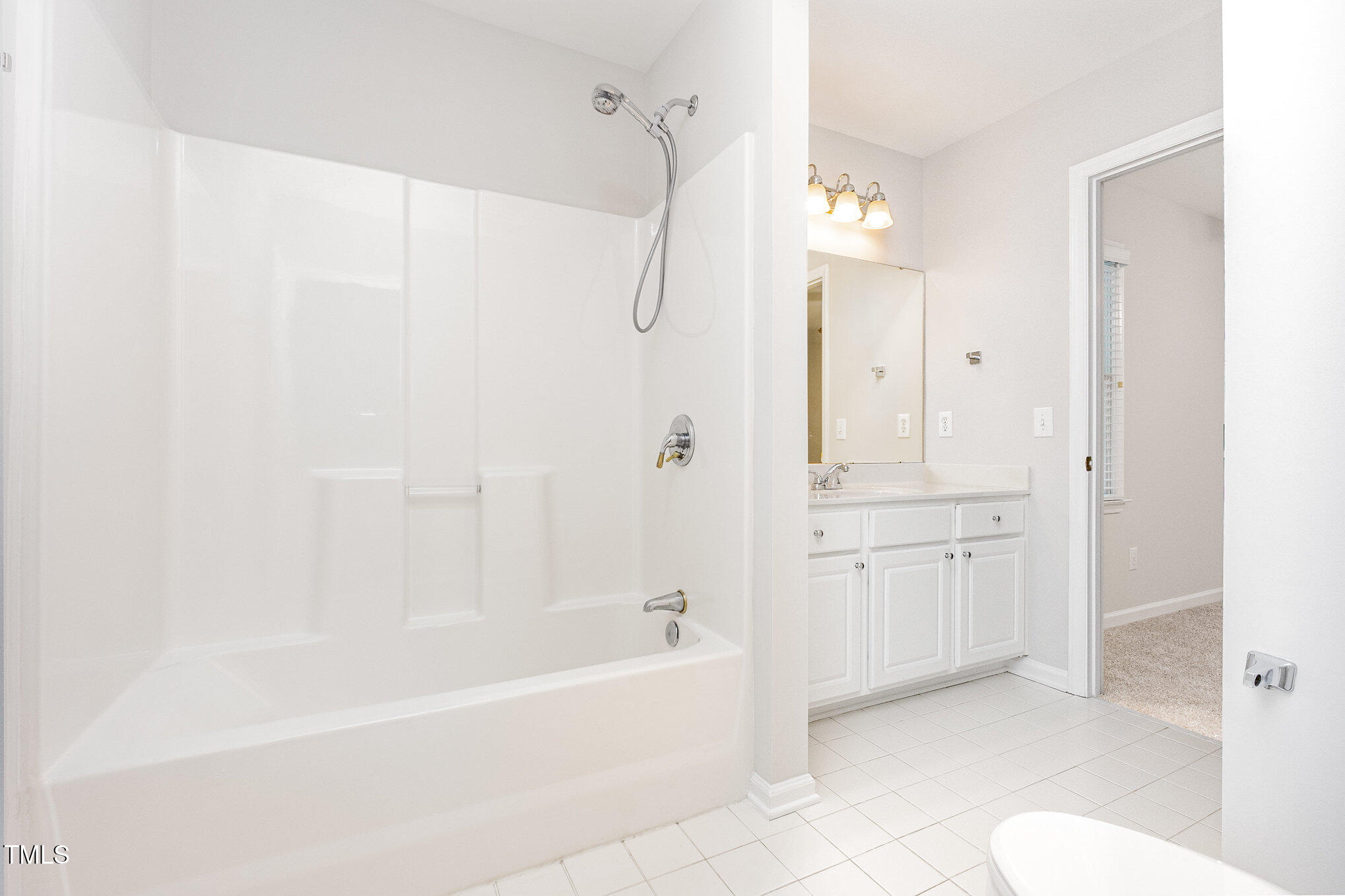 8401 Hobhouse Circle Raleigh, NC 27615 - Photo 18 of 27 a bathroom with a bathtub a toilet and a shower