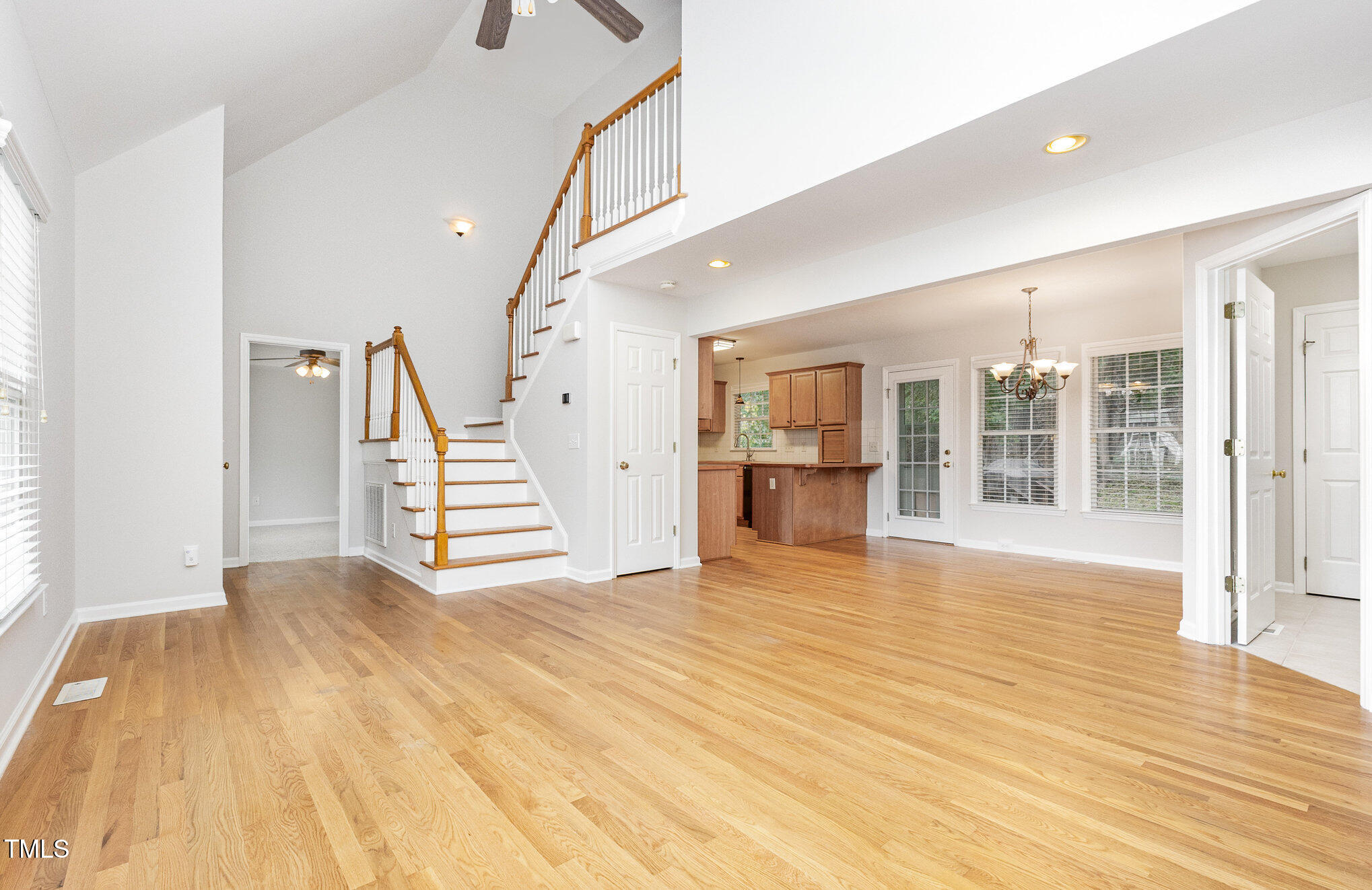 8401 Hobhouse Circle Raleigh, NC 27615 - Photo 7 of 27 a view of an empty room with wooden floor and a window