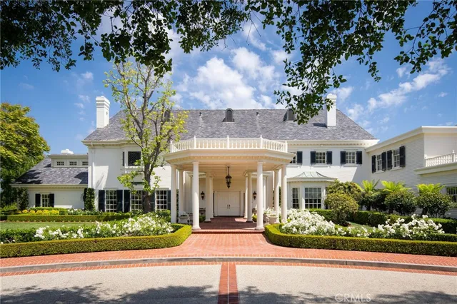 front view of a house with a garden