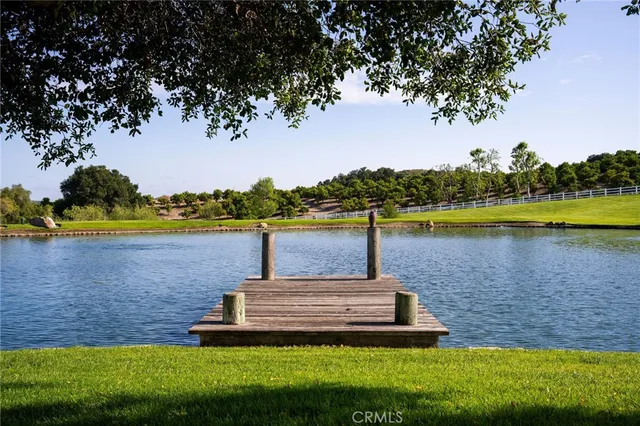 a view of a lake with houses in the back