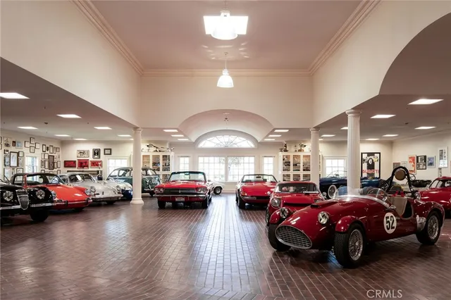 a living room with lots of furniture and a view of dining room