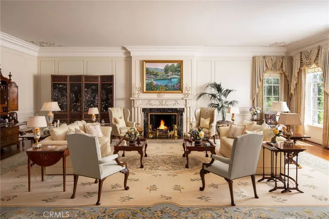 a living room with furniture a window and a fireplace