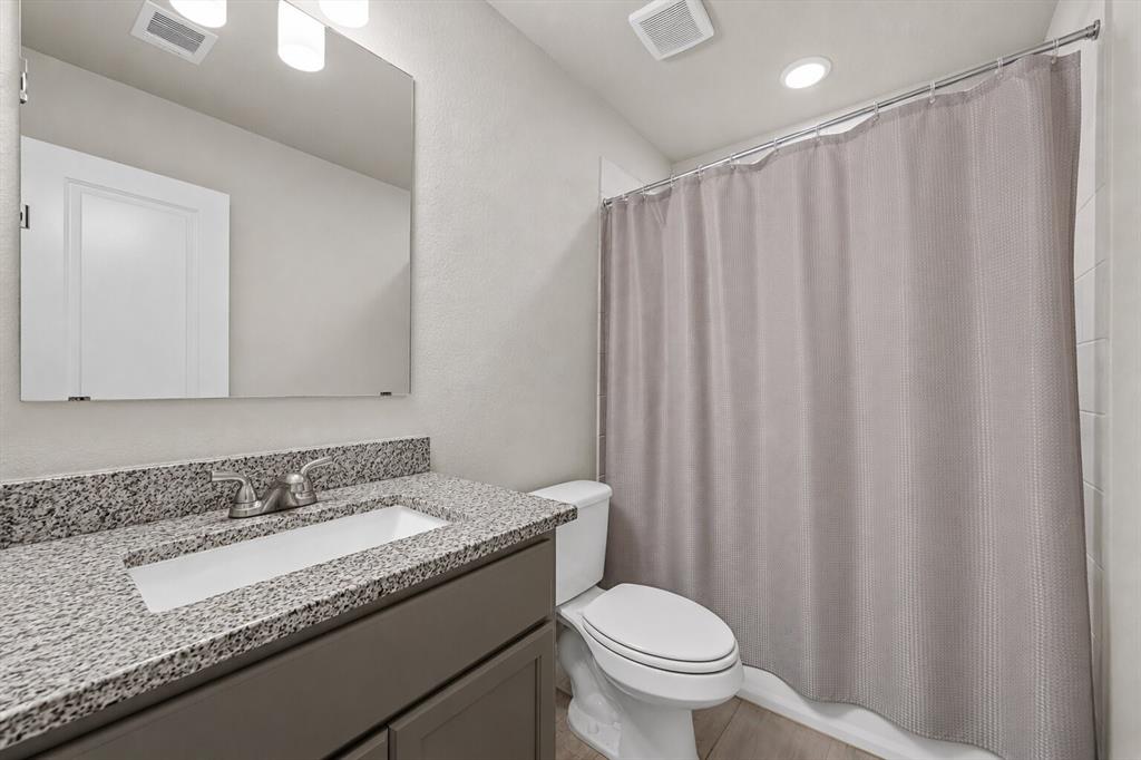 3213 Dottavio Road Lorena, TX 76655 - Photo 24 of 32 a bathroom with a granite countertop sink and a mirror