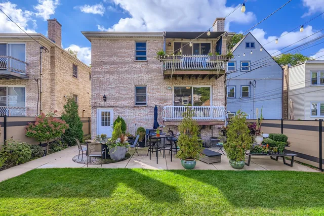 a view of a house with a yard porch and sitting area