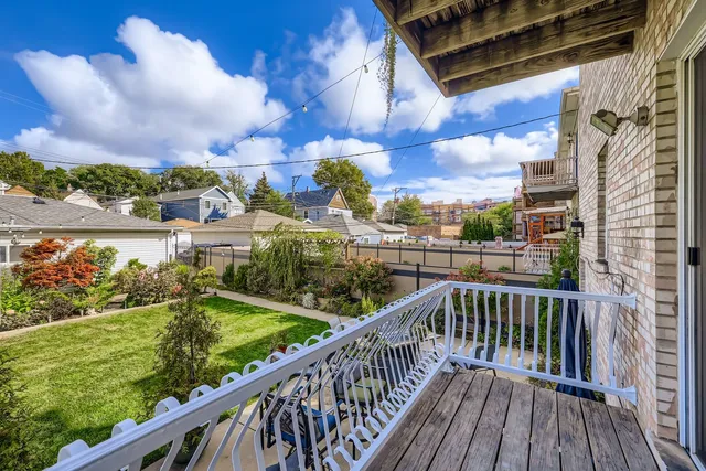 a view of balcony with wooden floor
