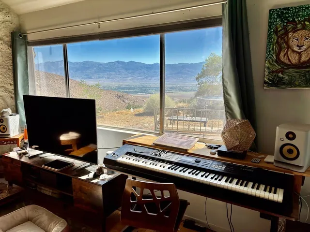 a laptop computer sitting on top of a table