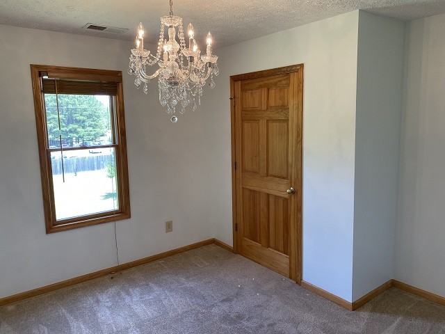 398 Azbill Road Lexington, TN 38351 - Photo 13 of 40 a view of a hallway with windows and chandelier