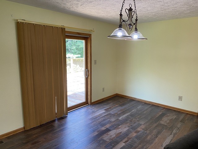 398 Azbill Road Lexington, TN 38351 - Photo 16 of 40 a view of a room with wooden floor and window