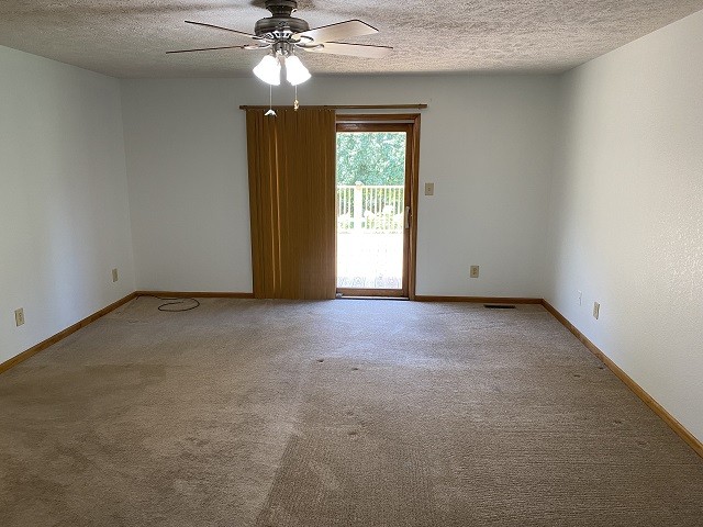398 Azbill Road Lexington, TN 38351 - Photo 18 of 40 a view of an empty room with a chandelier fan