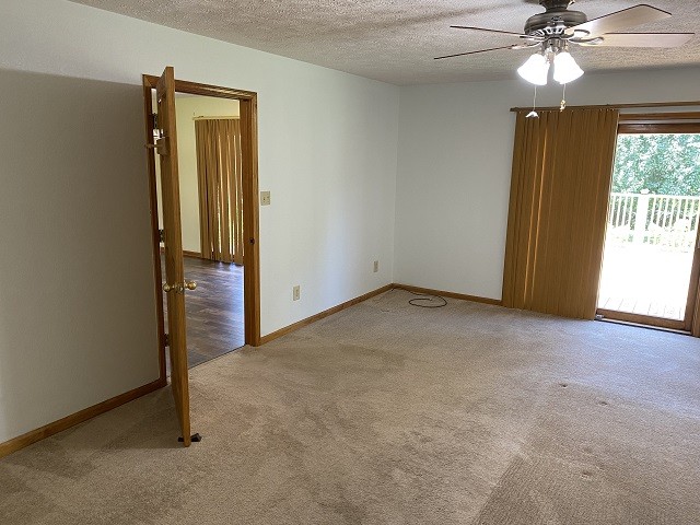 398 Azbill Road Lexington, TN 38351 - Photo 19 of 40 an empty room with windows and entrance