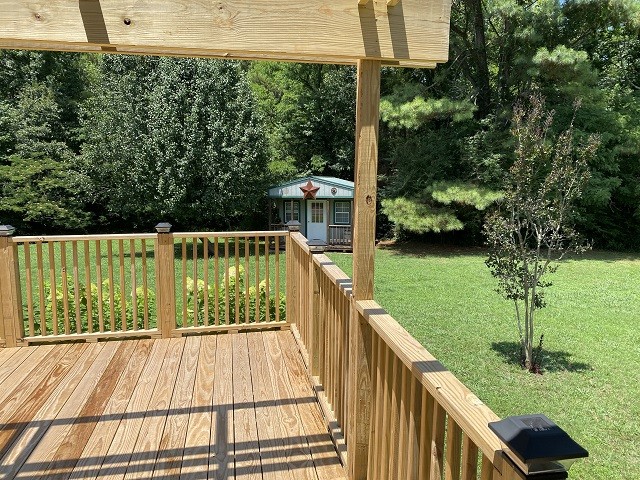 398 Azbill Road Lexington, TN 38351 - Photo 24 of 40 a view of balcony with floor to ceiling windows and wooden fence