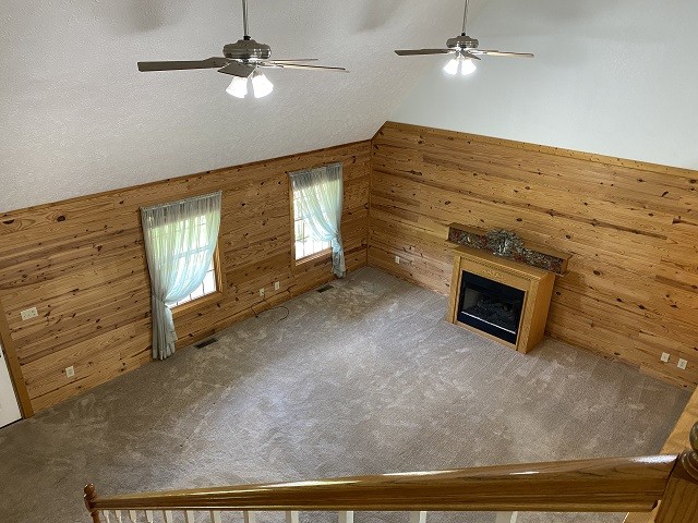 398 Azbill Road Lexington, TN 38351 - Photo 7 of 40 a view of an empty room with a fireplace and a ceiling fan