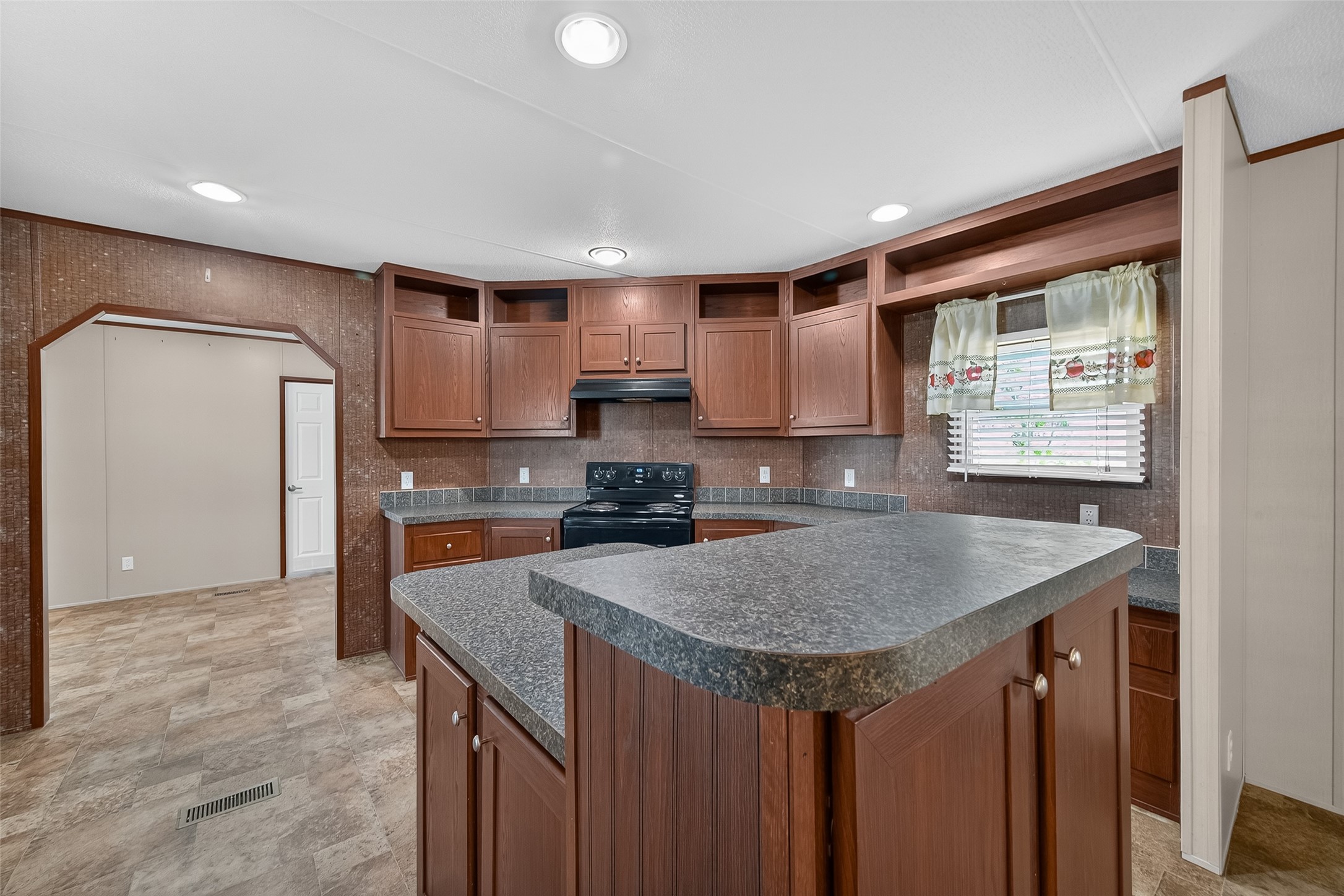13411 Zamanek Road Needville, TX 77461 - Photo 13 of 40 a kitchen with granite countertop kitchen island a sink stove and refrigerator