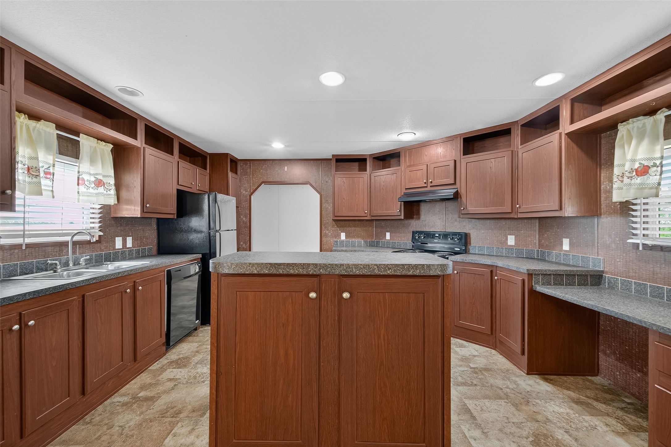 13411 Zamanek Road Needville, TX 77461 - Photo 14 of 40 a kitchen with stainless steel appliances granite countertop a sink stove and refrigerator