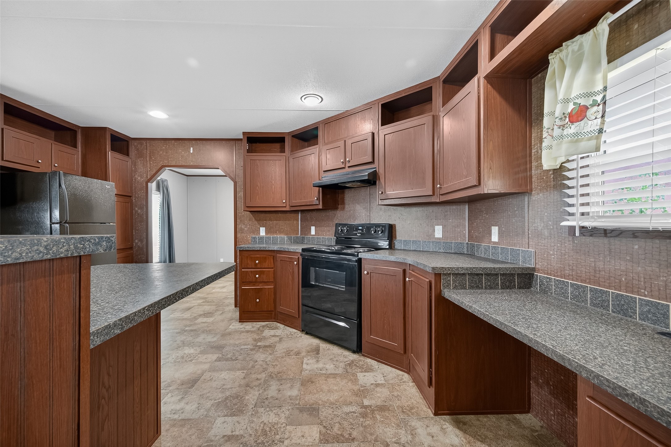 13411 Zamanek Road Needville, TX 77461 - Photo 15 of 40 a kitchen with stainless steel appliances granite countertop a sink stove microwave refrigerator and cabinets