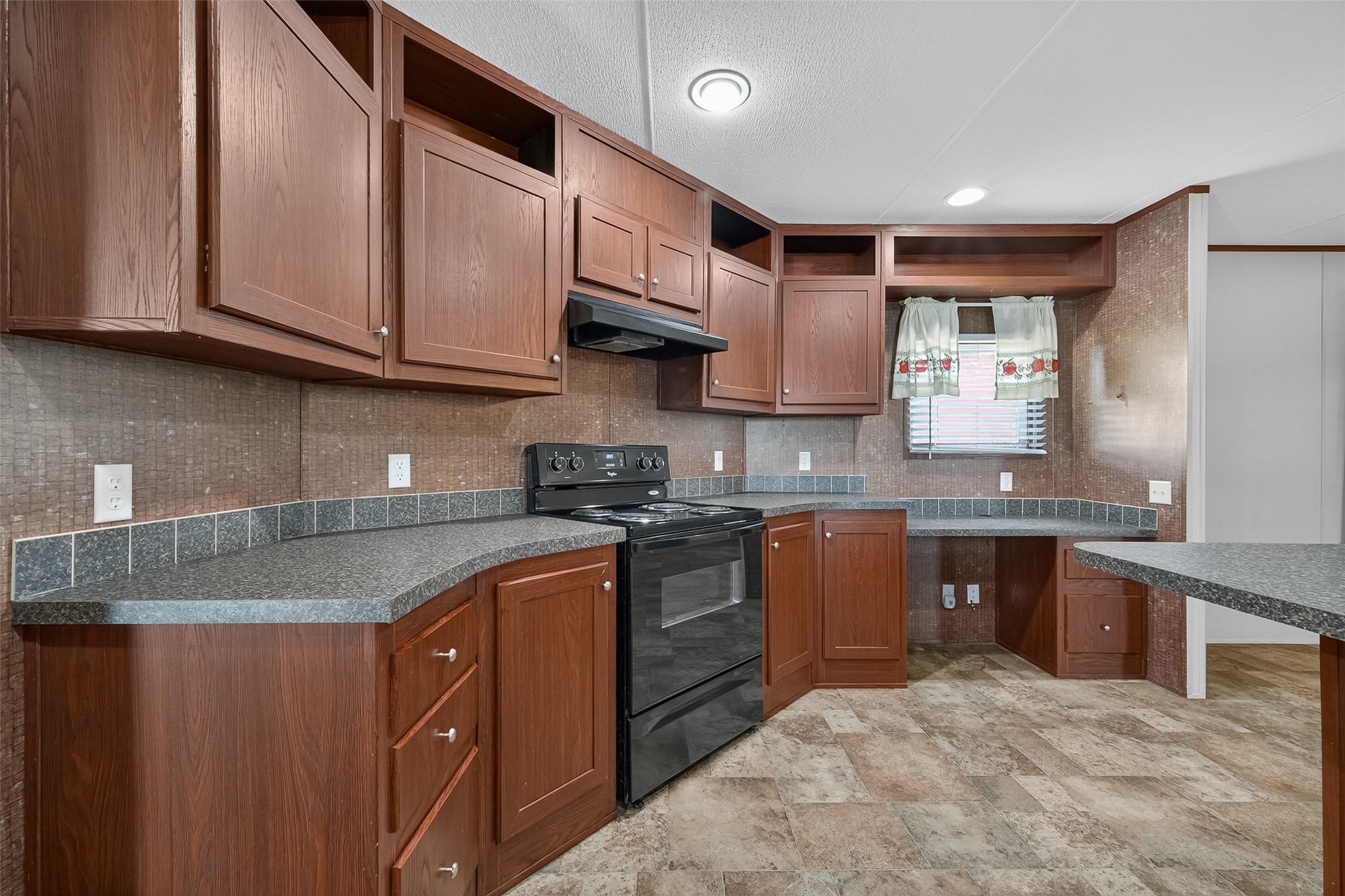 13411 Zamanek Road Needville, TX 77461 - Photo 16 of 40 a kitchen with stainless steel appliances granite countertop a sink stove and cabinets