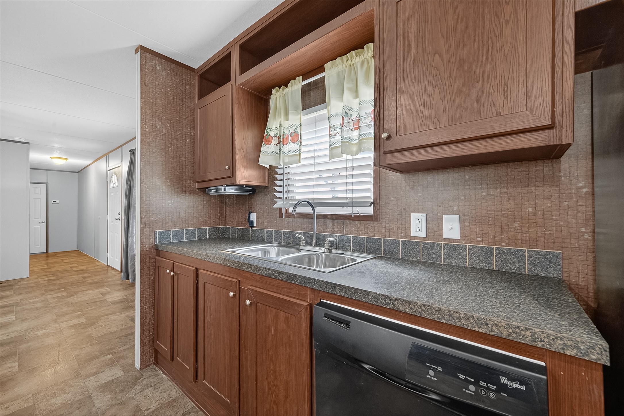 13411 Zamanek Road Needville, TX 77461 - Photo 20 of 40 a kitchen with granite countertop a sink a stove and cabinets