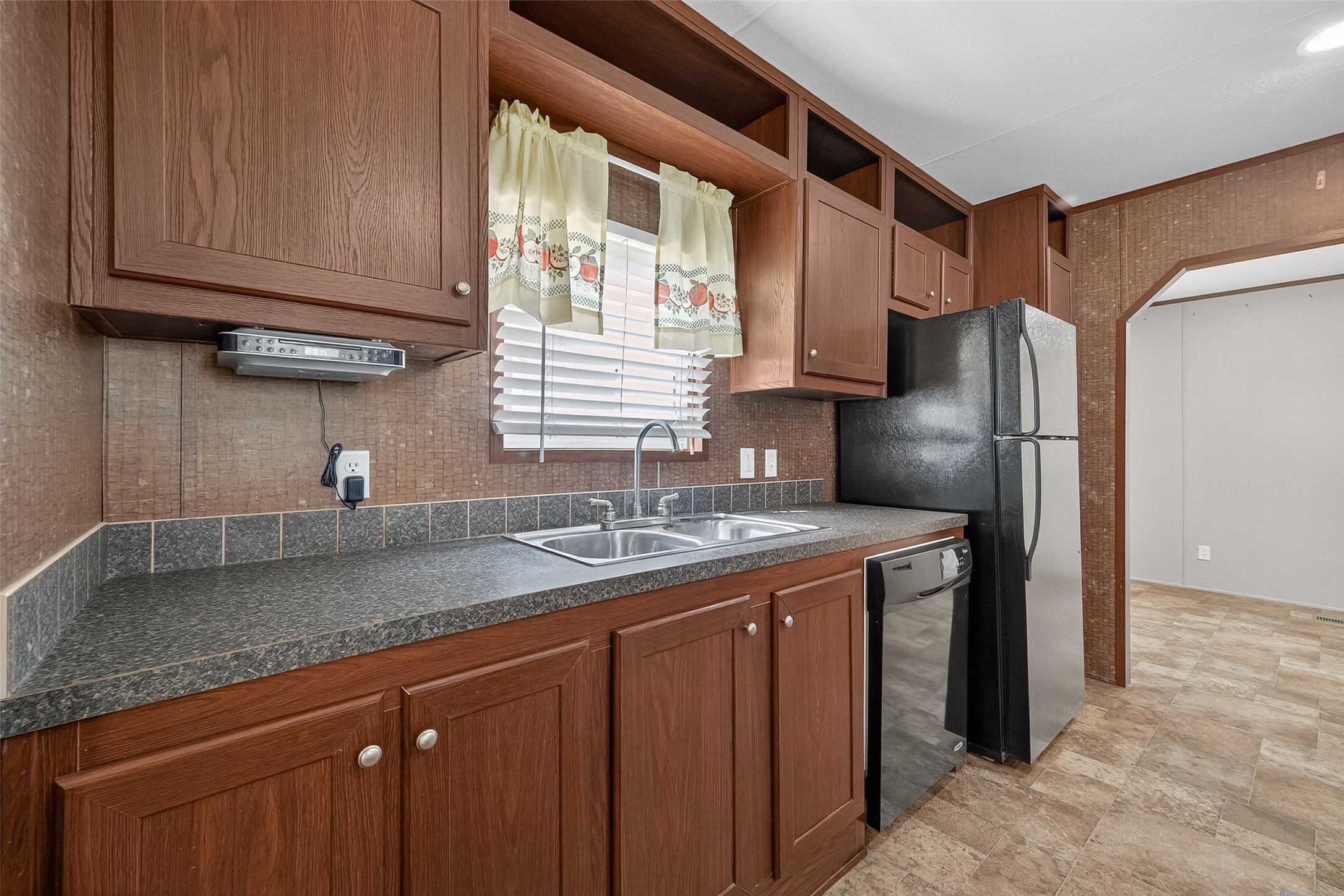 13411 Zamanek Road Needville, TX 77461 - Photo 21 of 40 a kitchen with stainless steel appliances granite countertop a sink stove and refrigerator