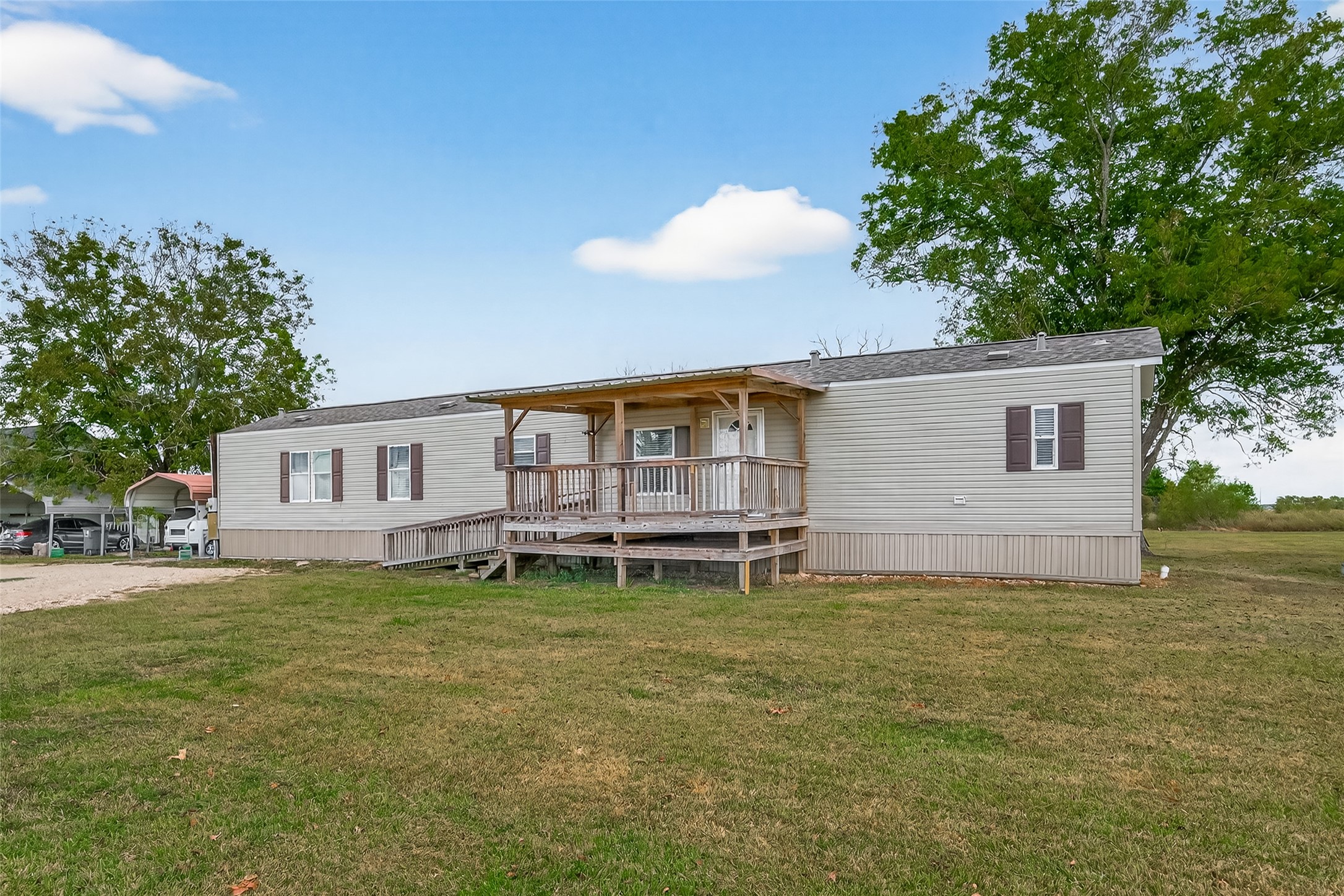 13411 Zamanek Road Needville, TX 77461 - Photo 3 of 40 a backyard of a house with table and chairs