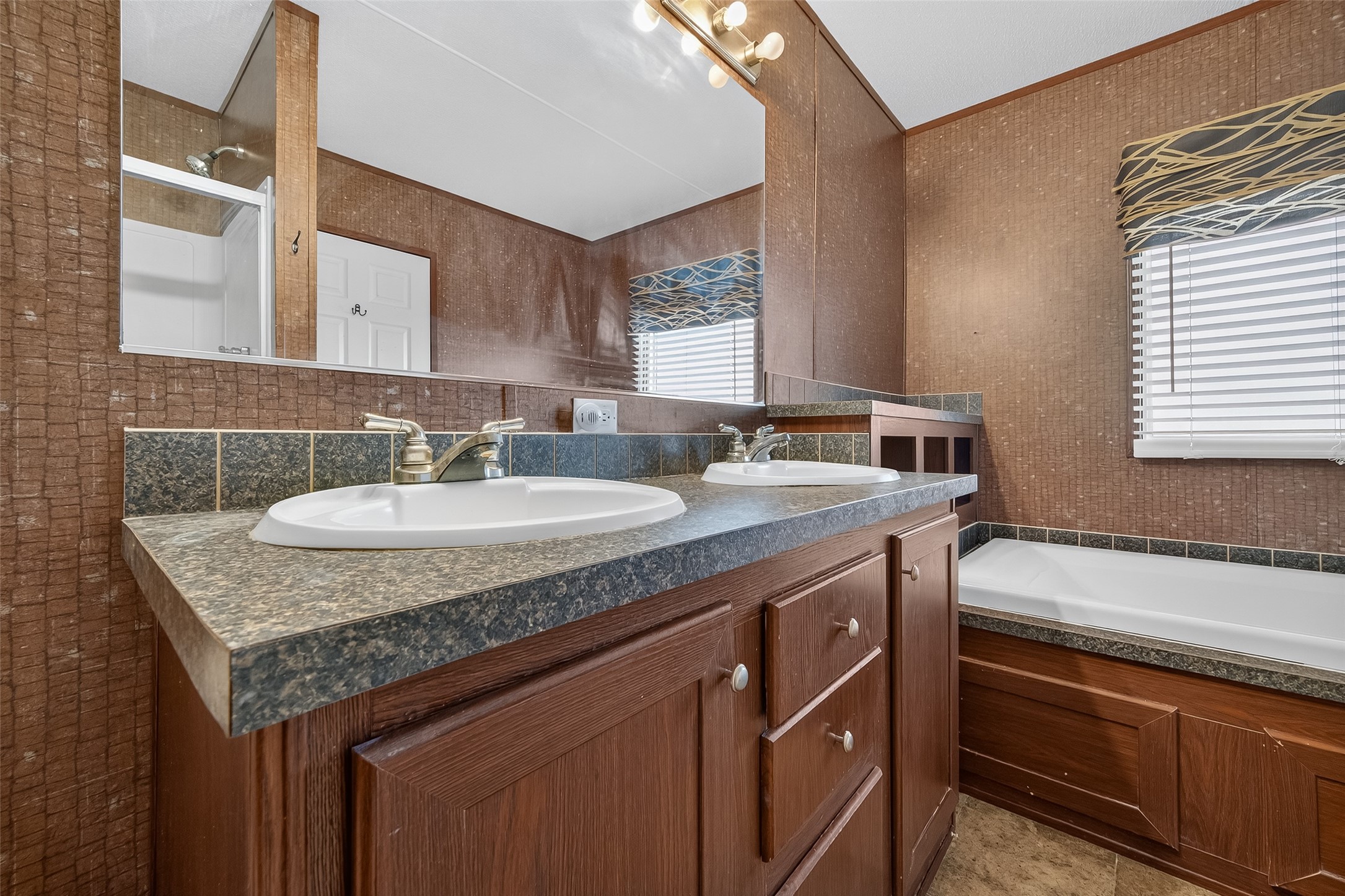 13411 Zamanek Road Needville, TX 77461 - Photo 36 of 40 a kitchen with granite countertop a sink and a stove