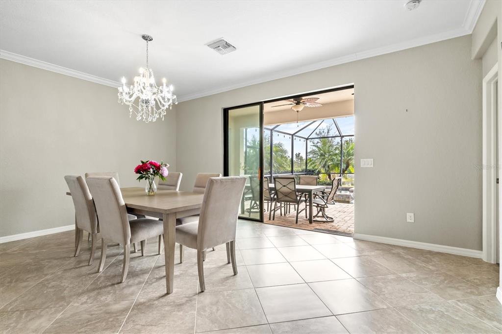 17030 Blue Ridge Place Bradenton, FL 34211 - Photo 13 of 65 a view of a dining room with furniture window and outside view
