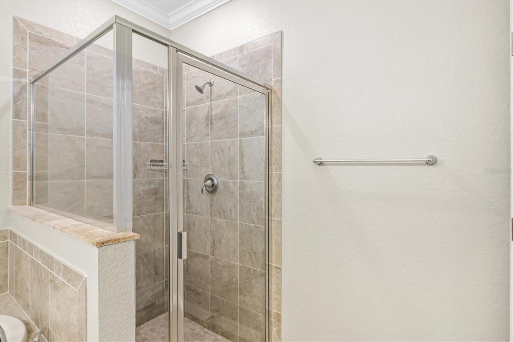 17030 Blue Ridge Place Bradenton, FL 34211 - Photo 25 of 65 a bathroom with a shower and a glass door