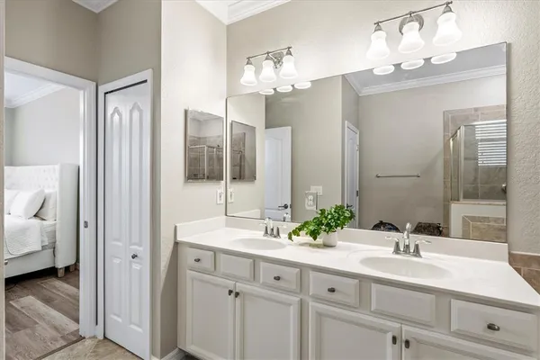 a bathroom with a sink mirror toilet and bathtub