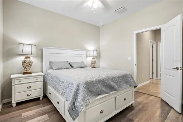 a bathroom with a bathtub shower sink vanity and toilet
