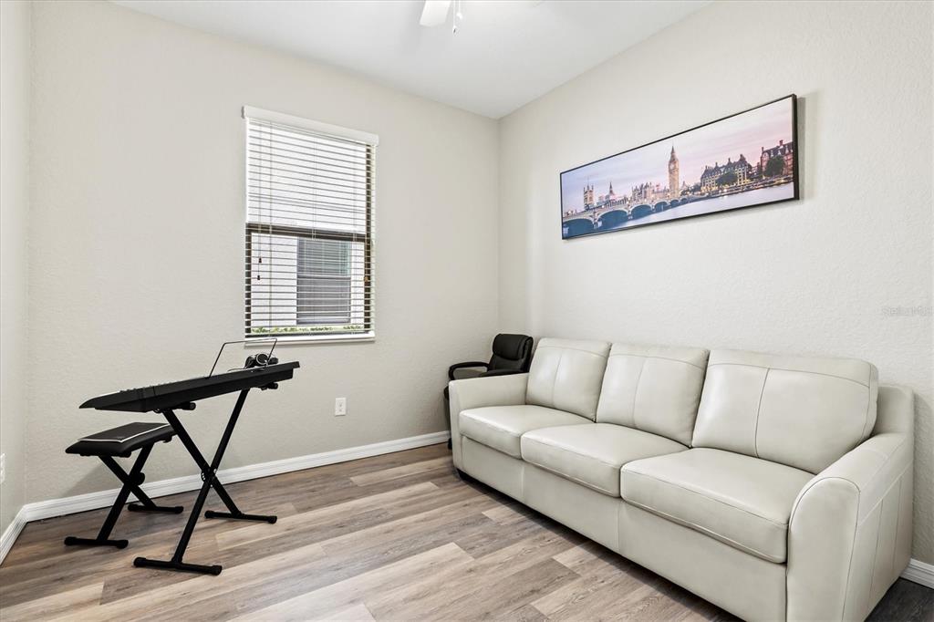 17030 Blue Ridge Place Bradenton, FL 34211 - Photo 29 of 65 a living room with furniture and a window