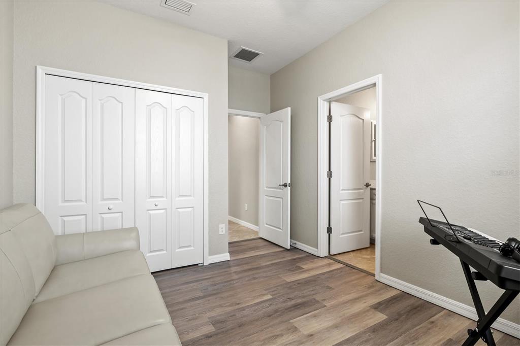 17030 Blue Ridge Place Bradenton, FL 34211 - Photo 30 of 65 a view of a room with wooden floor and bathroom
