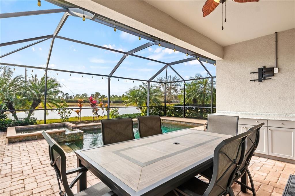 17030 Blue Ridge Place Bradenton, FL 34211 - Photo 39 of 65 a dining room with a table and chairs