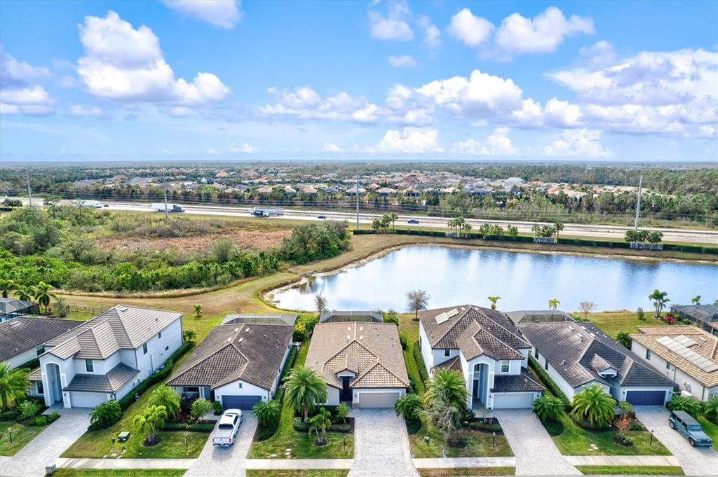 17030 Blue Ridge Place Bradenton, FL 34211 - Photo 55 of 65 an aerial view of swimming pool with outdoor space and lake view in back