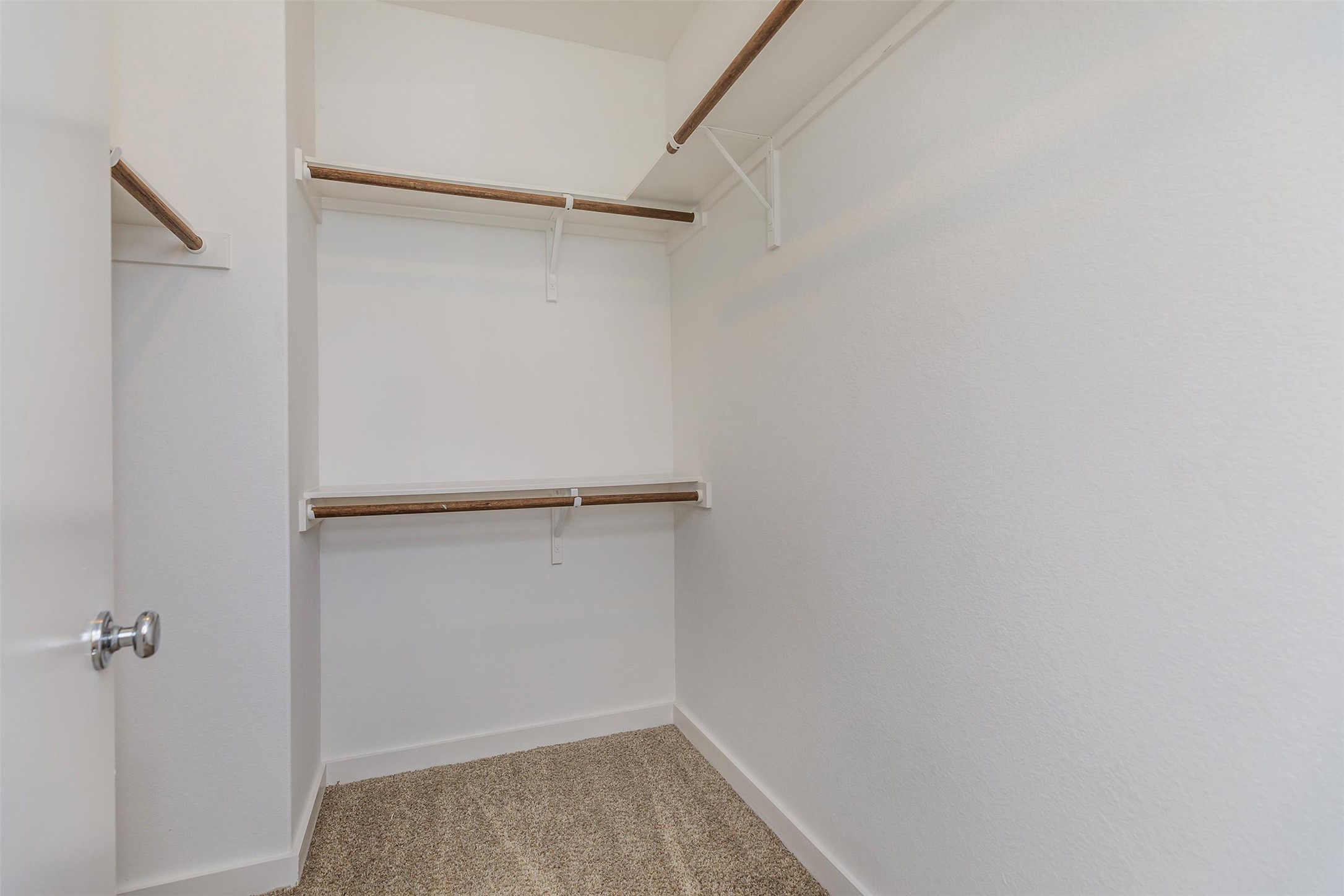 428 Ozark Trail Leander, TX 78641 - Photo 8 of 27 a view of walk in closet with empty racks
