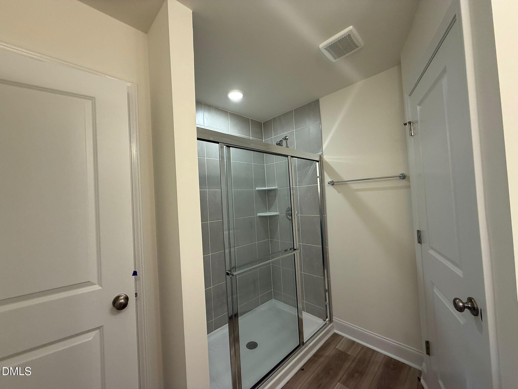 66 Bloodroot Street Angier, NC 27501 - Photo 11 of 16 a bathroom with a shower