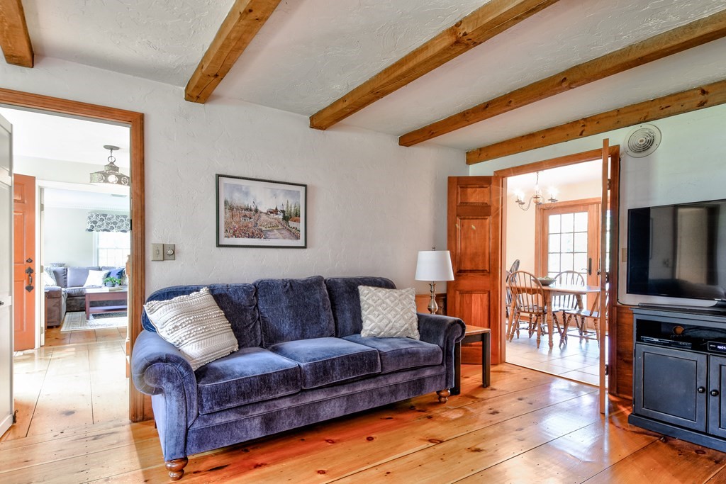 6 Dale Road Hopkinton, MA 01748 - Photo 11 of 39 a living room with furniture and a flat screen tv