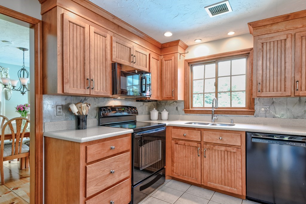 6 Dale Road Hopkinton, MA 01748 - Photo 16 of 39 a kitchen with stainless steel appliances granite countertop a sink stove and cabinets
