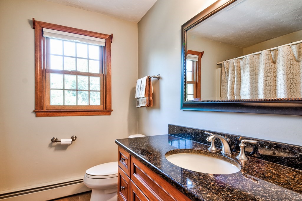 6 Dale Road Hopkinton, MA 01748 - Photo 26 of 39 a bathroom with a granite countertop toilet sink and mirror