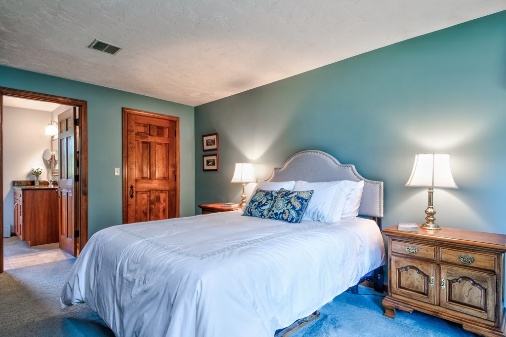 6 Dale Road Hopkinton, MA 01748 - Photo 28 of 39 a bedroom with a bed and a lamp