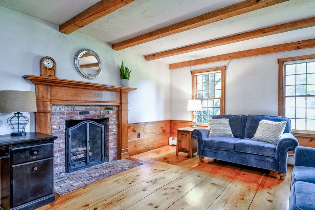 6 Dale Road Hopkinton, MA 01748 - Photo 9 of 39 a living room with furniture and a fireplace